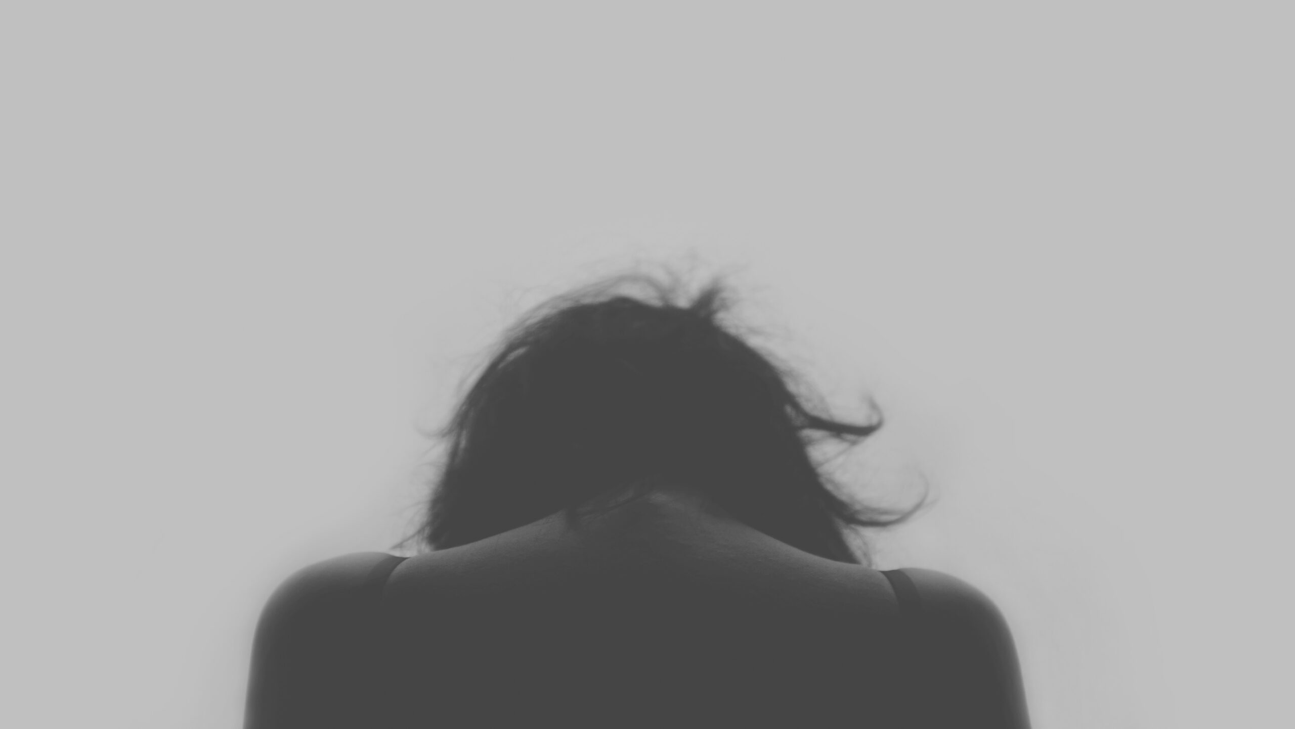 black and white picture of a woman and her shoulders used for article I'm tired of working on myself